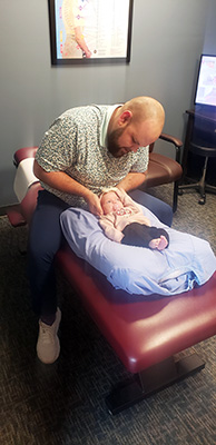 Chiropractor Erie PA Ian West Adjusting Infant